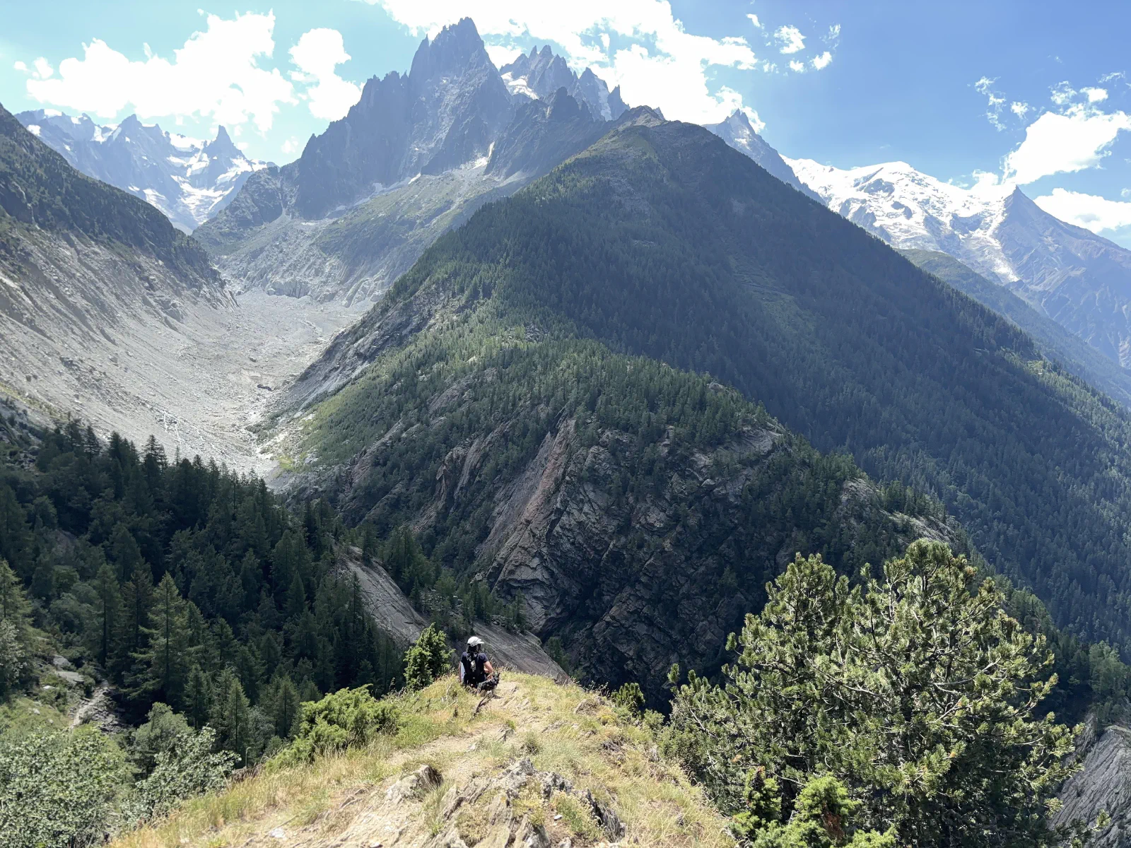 Leandra sitting at her favourite viewpoint, with the Mer de Glace, Montenvers and other mountains in the background